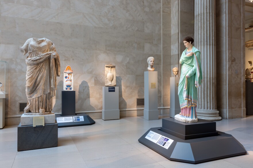 In the galleries, colorful, reconstructed pieces are placed near similar, more familiar originals of white marble.