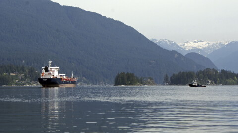 This May 3, 2018 photo shows the Kirkeholmen oil tanker anchored outside the Kinder Morgan Inc. Westridge oil terminal in Vancouver, Canada, at the end of the Trans Mountain pipeline that begins in northern Alberta.