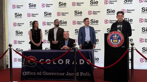 Yancey Strickler, co-founder of the crowdfunding platform Kickstarter, speaks at a bill signing for Senate Bill 133, which creates a new business structure in Colorado tailored to artists. Strickler came up with the idea and gave a TED talk on the concept in 2025. Colorado is the first state to enact the new structure, a subset of a limited liability corporation.