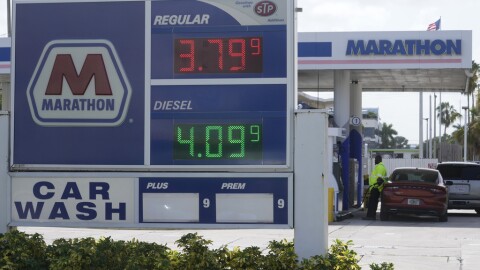 A customer pumps gas at a Marathon gas station, Tuesday, Aug. 22, 2023, in North Miami.