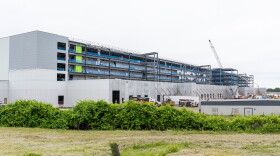 FILE: View of an Amazon warehouse building under construction in Windsor, CT on June 3, 2021. In the month prior, a total of eight nooses were discovered at the construction site.