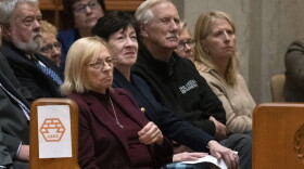 Maine Gov. Janet Mills, front left, and Sens. Susan Collins and Angus King attend a vigil for the victims of mass shootings days earlier, at the Basilica of Saints Peter and Paul, Sunday, Oct. 29, 2023, in Lewiston, Maine.