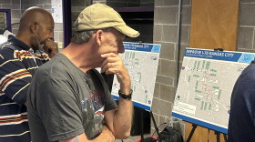 A man looks over a map of I-70.