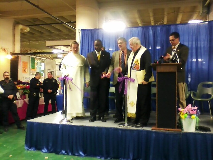 Mayor Brown helps cut the ribbon for Easter Season at Broadway Market