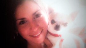 Nicole LaDue holds her dog Mickey before he was killed in 2005 by her abuser, LaDue said.