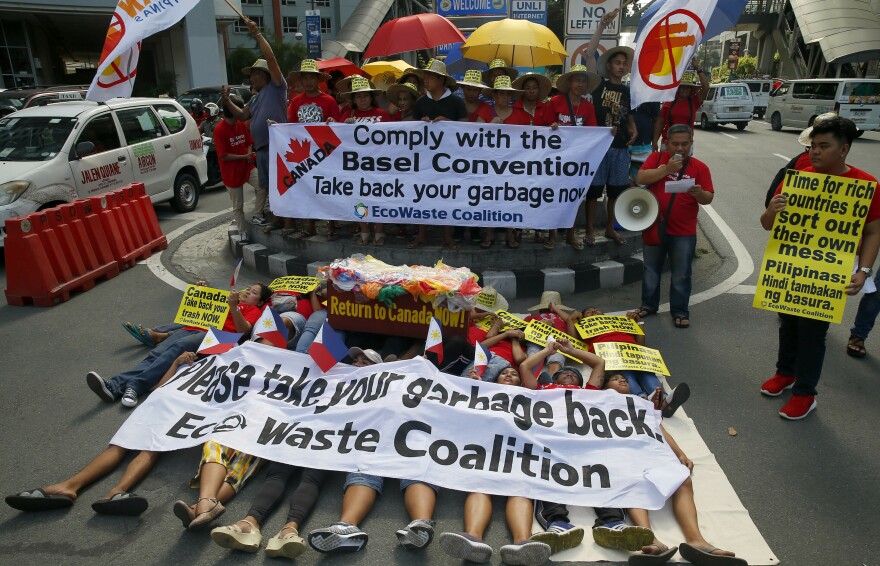 Environmentalists staged a mock die-in protest earlier this month outside the Canadian Embassy in Manila to demand the Canadian government speed up the removal of its garbage.