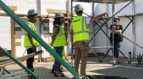 Kelsey McCarthy and her children get a quick tour of the interior of their new Habitat house in Spokane's East Central neighborhood in 2022.