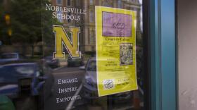 A poster for Noblesville Schools hangs in a coffee shop window. (News File Photo)