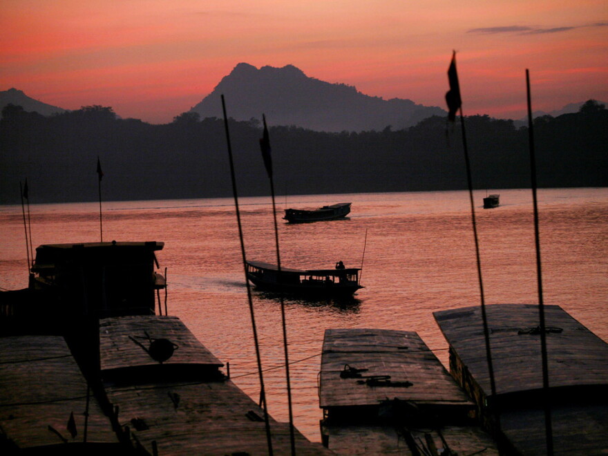 The sun sets over the Mekong River in Luang Prabang, Laos' ancient royal capital.
