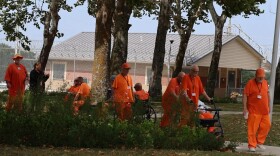 Elderly prisoners walk to the chow hall at the John H. Lilley Correctional Center on Aug. 8, 2025