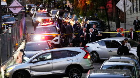 Law enforcement work the scene of a shooting Thursday, Oct. 8, 2026, in New York. (AP Photo/Seth Wenig)