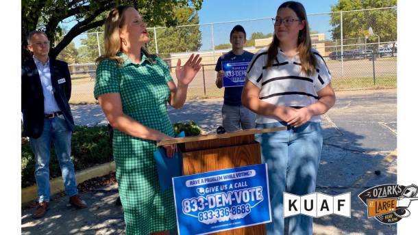 Former Democratic state Rep. Megan Godfrey announces the party's voter protection hotline at Elmdale Baptist Church in Springdale.