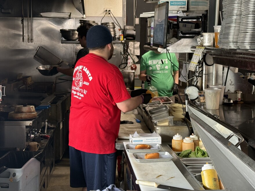 Tyler Cranis prepares some burgers