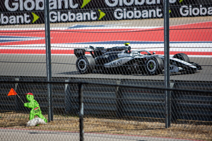 A Cadillac driver rounds turn 16 during the third practice session at the United States Grand Prix.