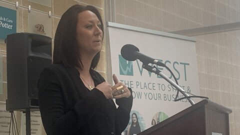 Women's Economic Self-Sufficiency Team President Lindsey Kay speaks to attendees at the Aug. 21 Association of Women's Business Centers Spotlight Tour event at WESST's Albuquerque office.