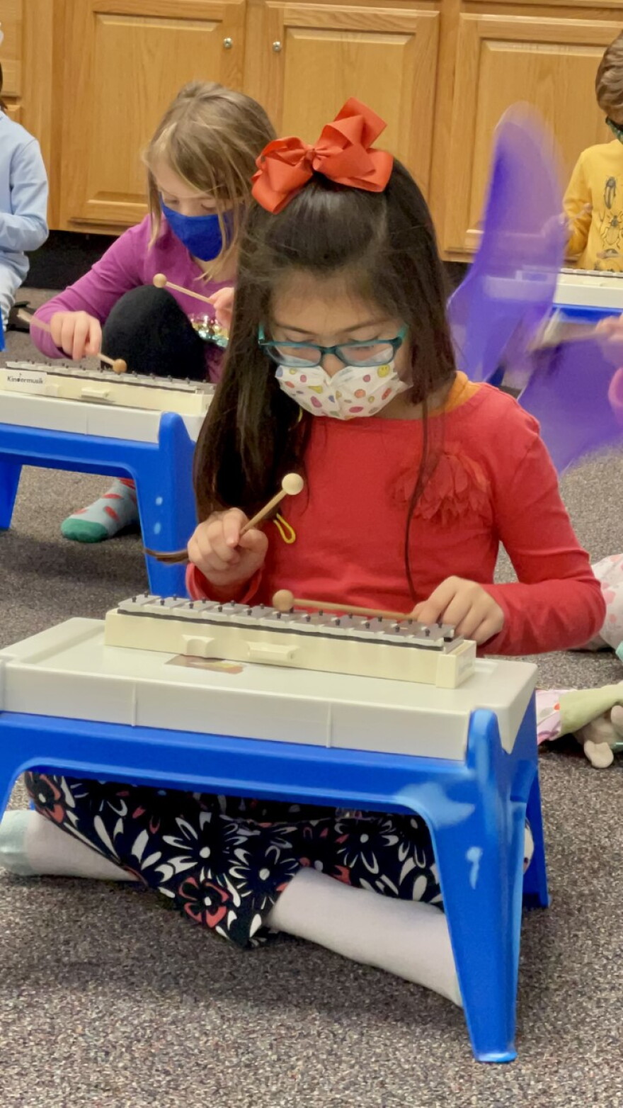Calvo's oldest daughter, Arianna, participating in the Western Avenue Community Center's Kindermusik program.