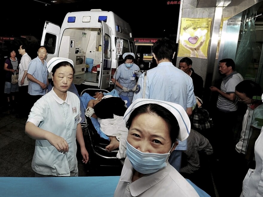 An injured man  arrives at a hospital in Chengdu on a stretcher following an explosion at an electronics factory owned by Foxconn Technology Group, which makes many Apple products. Poor working conditions and low pay at such factories has made many consumers push for Apple to contract work more selectively.