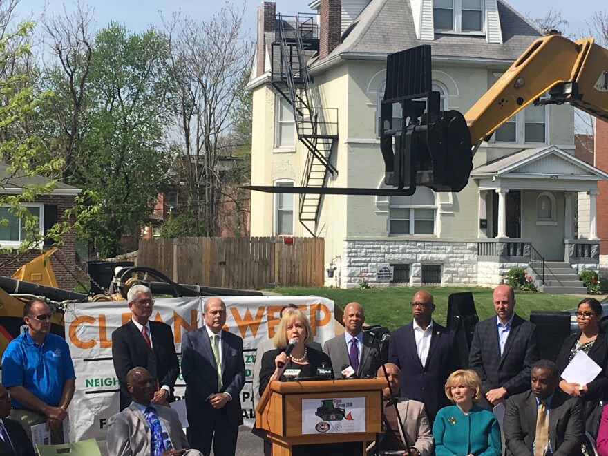 Mayor Lyda Krewson stands with community members at the announcement for the 2018 Clean Up campaign.  The program will kick off this month and will aim at cleaning up four neighborhoods in St. Louis.