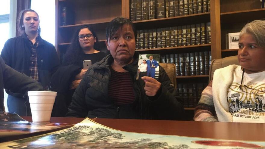 Maria Gomez-Velasquez holds a picture of her son Jilmar Ramos-Gomez.