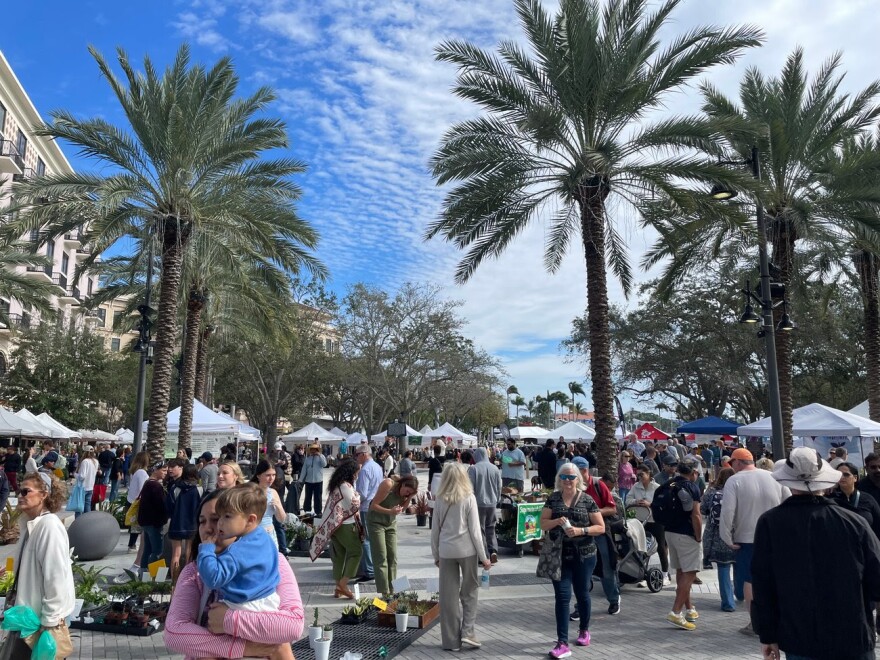 FILE - Shoppers at West Palm Beach’s green market, in 2024.