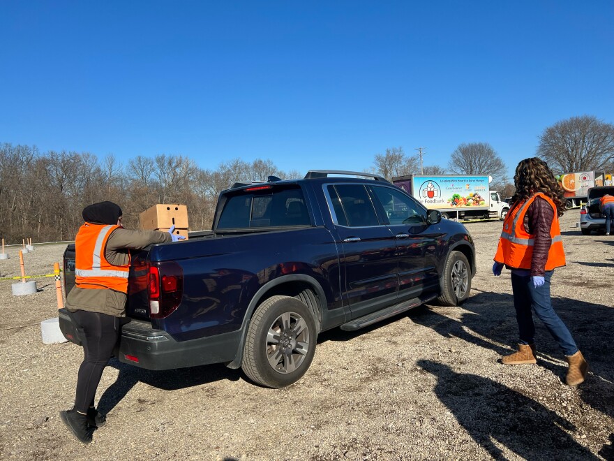 CareSource volunteers loading boxes of food at the Dixie-Twin Drive-in food distribution.