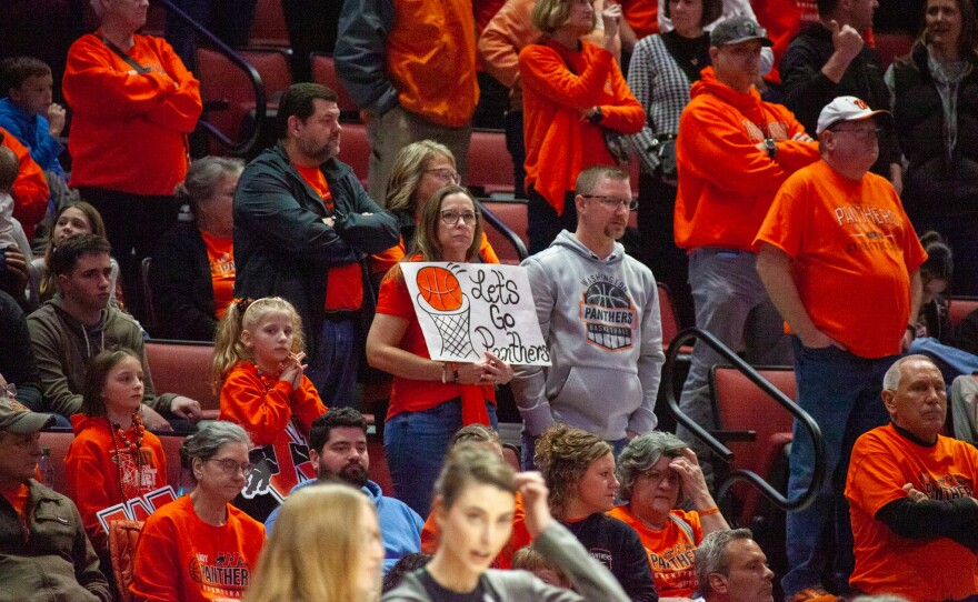 Girls high school basketball players inside an arena