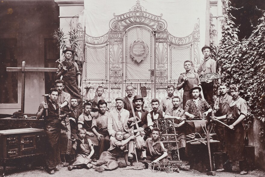 A group of men standing together in a black and white photograph