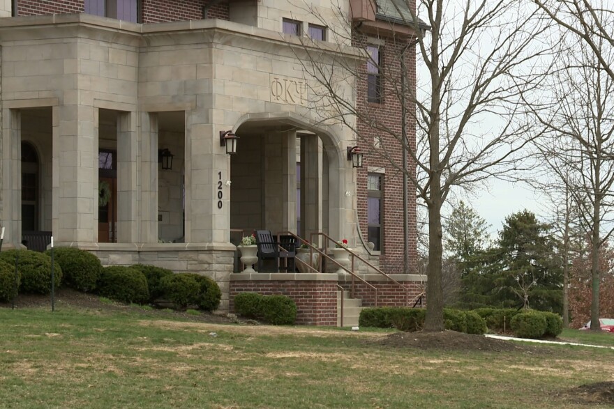 A brick and limestone fraternity house belonging to Phi Kappa Psi