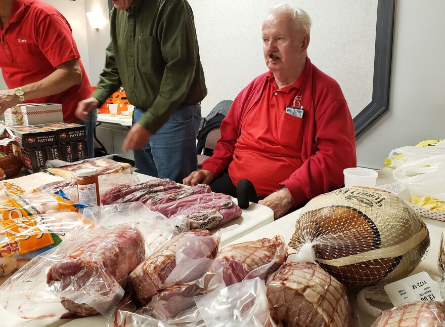 Meat sentry Ray Stack oversees raffle prizes at the Polish Falcons Hall in Depew, N.Y.