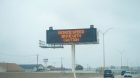  A TxDOT sign on I-35 warns drivers to take caution when driving during the 2023 winter ice storm.