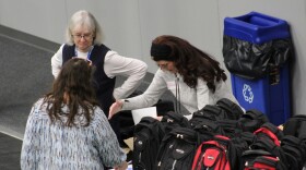 Cathy Gensel (rear left) helps coordinate the 2026 Project Homeless Connect event on Tuesday, Jan. 27, 2026 in Soldotna, Alaska.