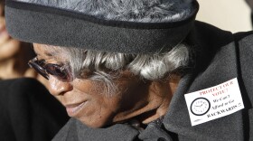 This Tuesday Jan. 31, 2012 file photo shows State Sen. Yvonne Miller, D-Norfolk, as she listens to speeches during a rally at the Capitol in Richmond, Va. Miller, the first African American woman elected to Virginia's state legislature, died in 2012. She was 77.