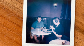Every guest who visits Antagonist leaves with a Polaroid photo taken by staff. That includes WFAE’s Nick de la Canal, photographed mid-interview with bar co-owner Mike Salzarulo.
