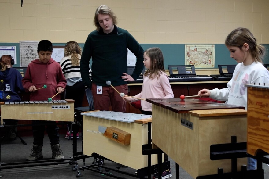 Kids in Maggie Olivo's music class work to compose their own melodies on the xylophone.