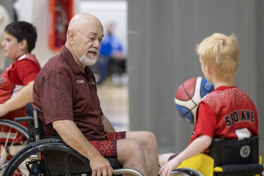 ParaSport Spokane assistant coach Z Zubrick and 11-year-old player Kaycen Dobbens.