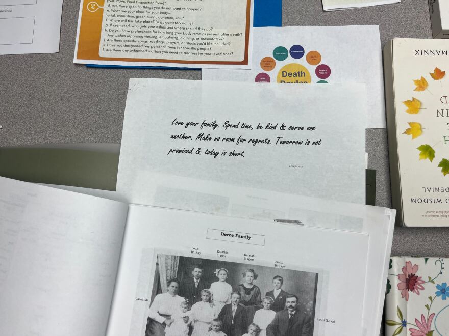 Image of papers and pictures on a table.