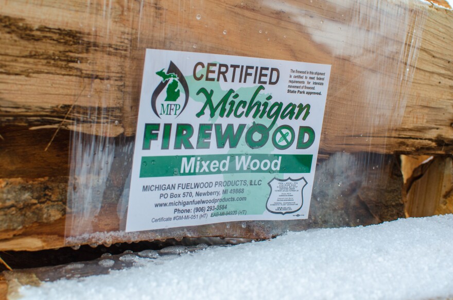 Packages of certified Michigan firewood being sold outside a service station in Mackinac County. (John Pepin/Michigan Department of Natural Resources)