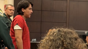Anghelo Ita Durand walking into the courtroom getting ready to speak with the judge.