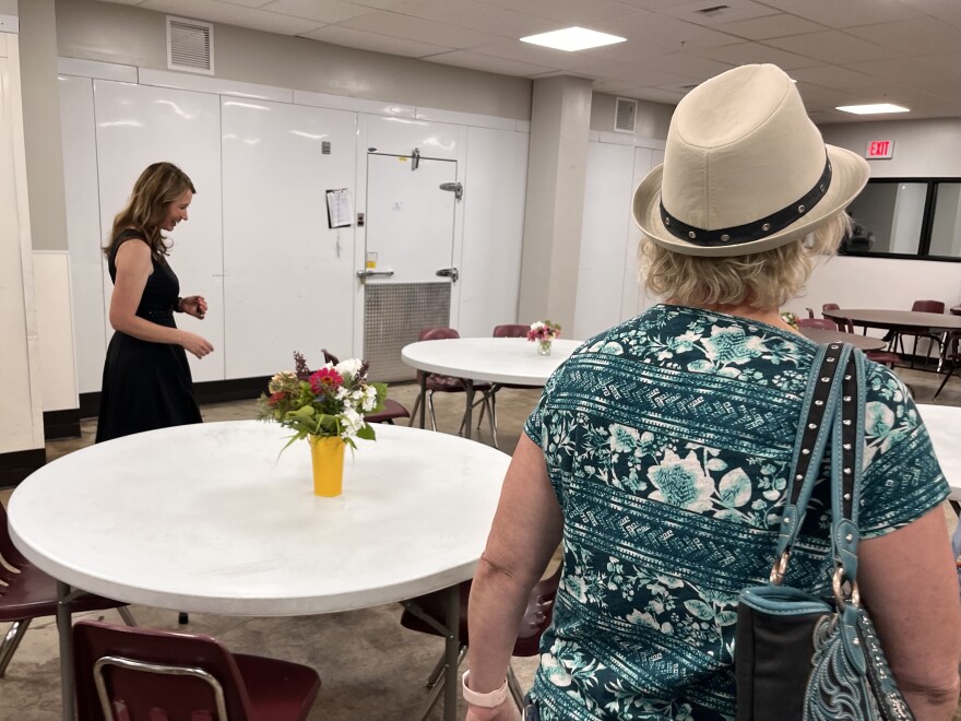 Billings Leadership Foundation executive director Dyann Romeijn (left) leads legislators through the Montana Rescue Mission cafeteria.