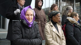 About 20 people stood vigil to mark two recent deaths at a homeless camp in Seattle.