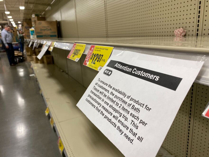 A sign at H-E-B tells customers they are limited to two items of bath tissue per shopping visit.