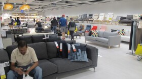 Shoppers walking around an IKEA chair showroom in the new Columbus IKEA.