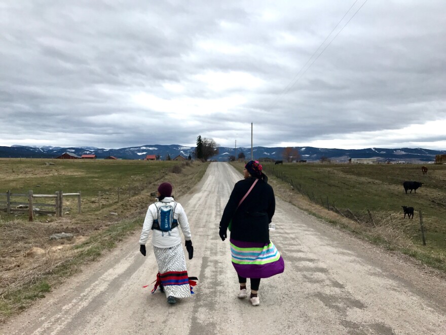 Marita Growing Thunder (right) walks along Hillside Rd in honor  of missing and murdered indigenous women on March 27. Tuesday was day three of a four day 80 mile walk.