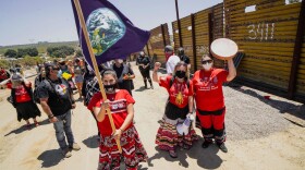 Members of the Kumeyaay band of Indians and demonstrators rally at the United States-Mexico border to protest construction of new wall being constructed on their ancestral grounds on July 1, 2020 in Boulevard, California.(SANDY HUFFAKER/AFP via Getty Images)