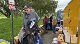 Chris Young and Maurice Fowler browse clothes provided by The Valor Clinic at the Wilkes-Barre VA's Chaleng Summit.