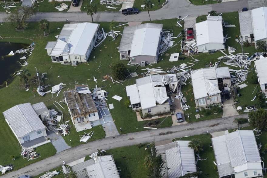 Homes that sustained wind damage caused by Hurricane Ian are seen in this aerial view, Thursday, Sept. 29, 2022, in Fort Myers, Fla. (AP Photo/Marta Lavandier)