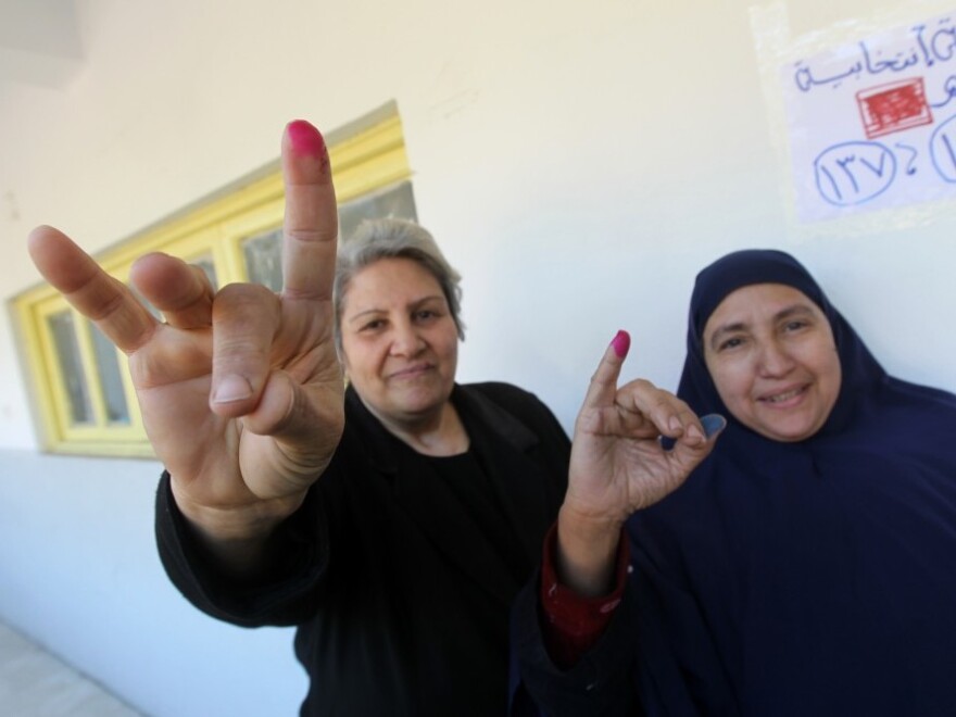 Egyptian women show their ink-stained fingers after voting at a polling station earlier this month. According to the election results, less than 2 percent of parliamentarians will be female.