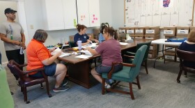 Volunteers for For AR Kids work to count ballot signatures, Tuesday.