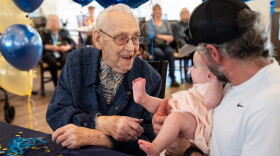 Beryl Dillman, 108, greets his newest great-grandchild Bella Rose Sturges at his birthday celebration on Oct. 1, 2026 in Eugene, Ore. Dillman's family believes he could be the oldest living man in the state of Oregon.