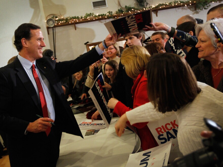 Republican presidential candidate Rick Santorum greets people during a campaign stop  on Feb. 26, 2012 in Davison, Michigan. Michigan residents will go to the polls on Feb. 28 to vote for their choice in the Republican presidential race.